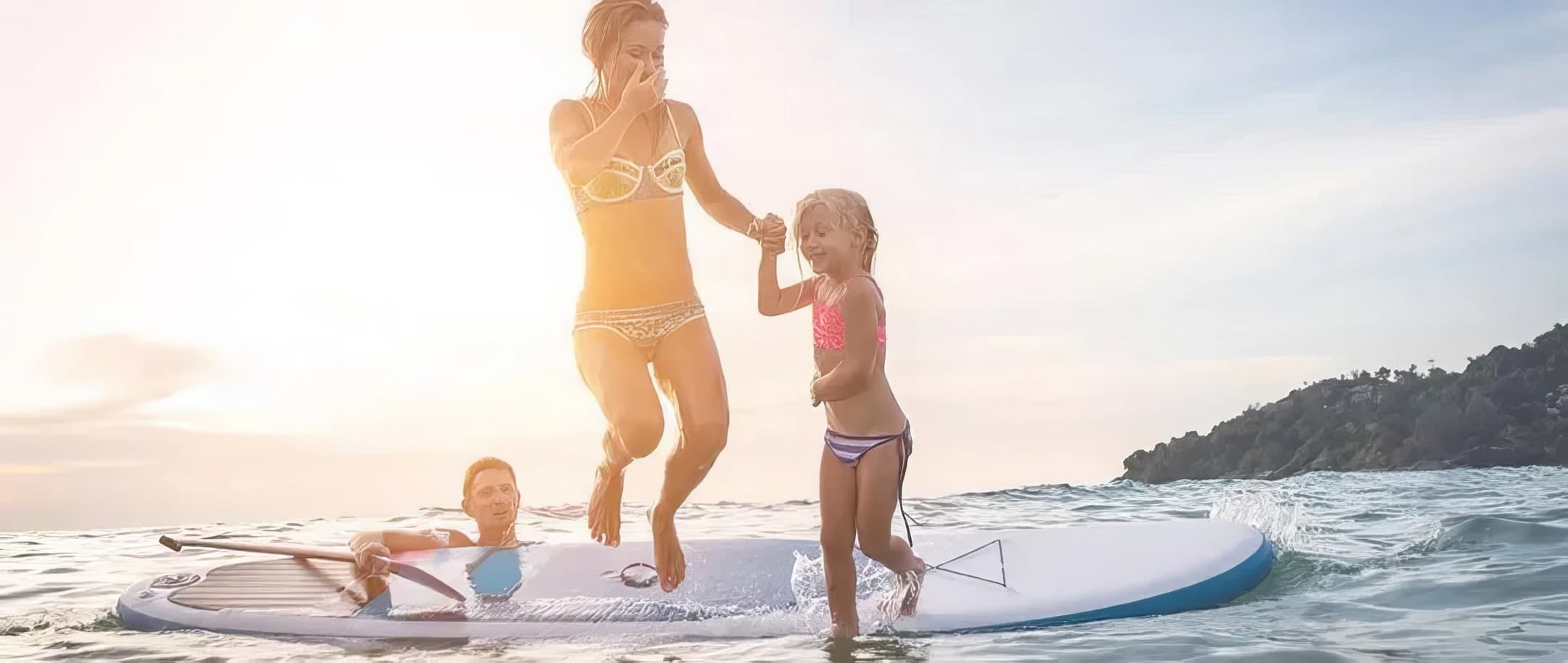 Family paddleboarding near a Castle resort