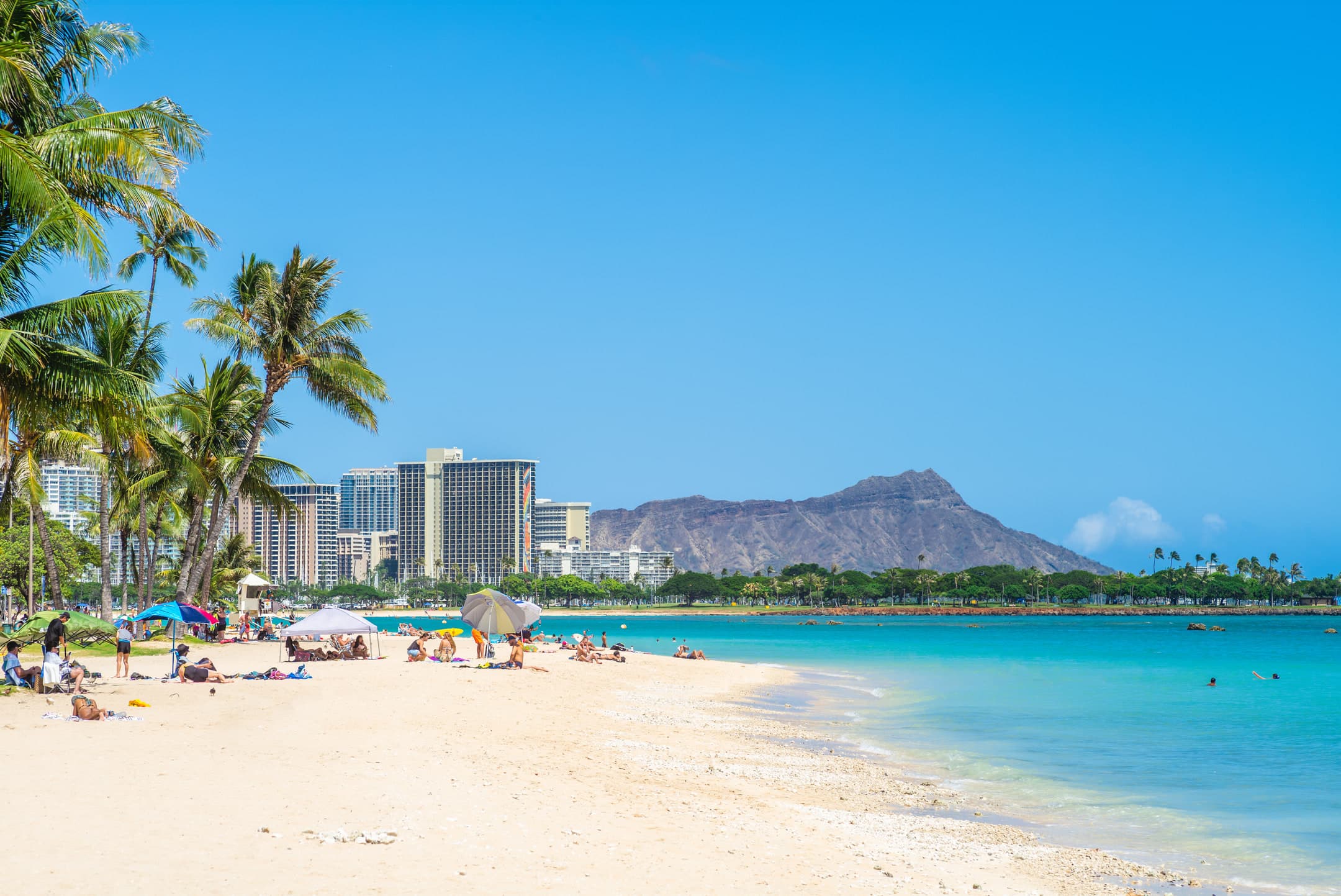 Waikīkī Beach with Diamond Head rising beyond the shoreline on Oʻahu