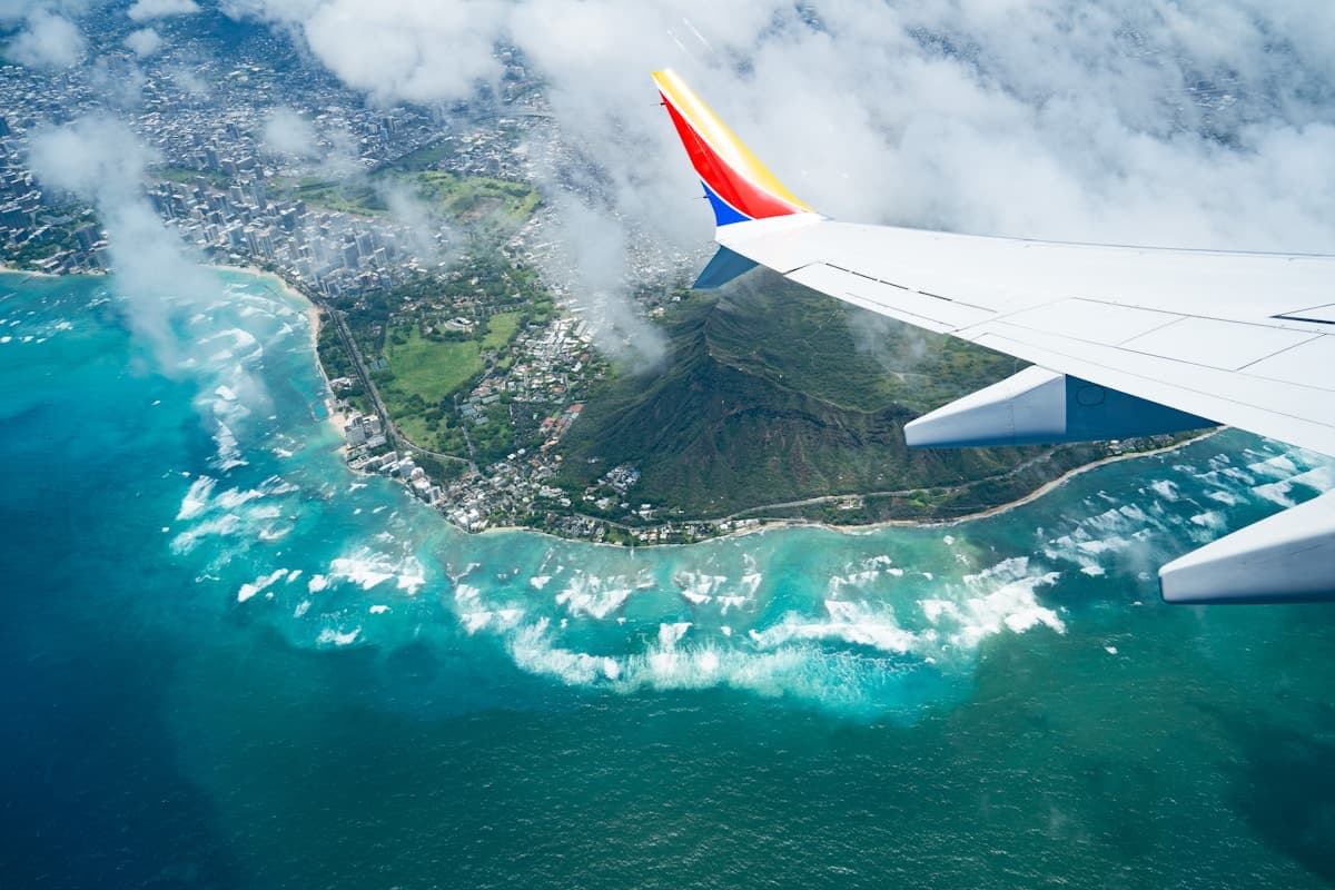 Aerial view of the Honolulu shoreline and Waikīkī high-rises at dusk