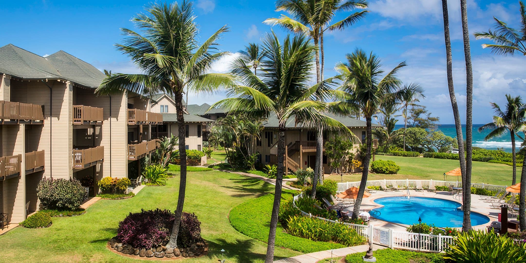 Aerial view of the pool at Castle Kaha Lani Resort on Kauaʻi's Coconut Coast