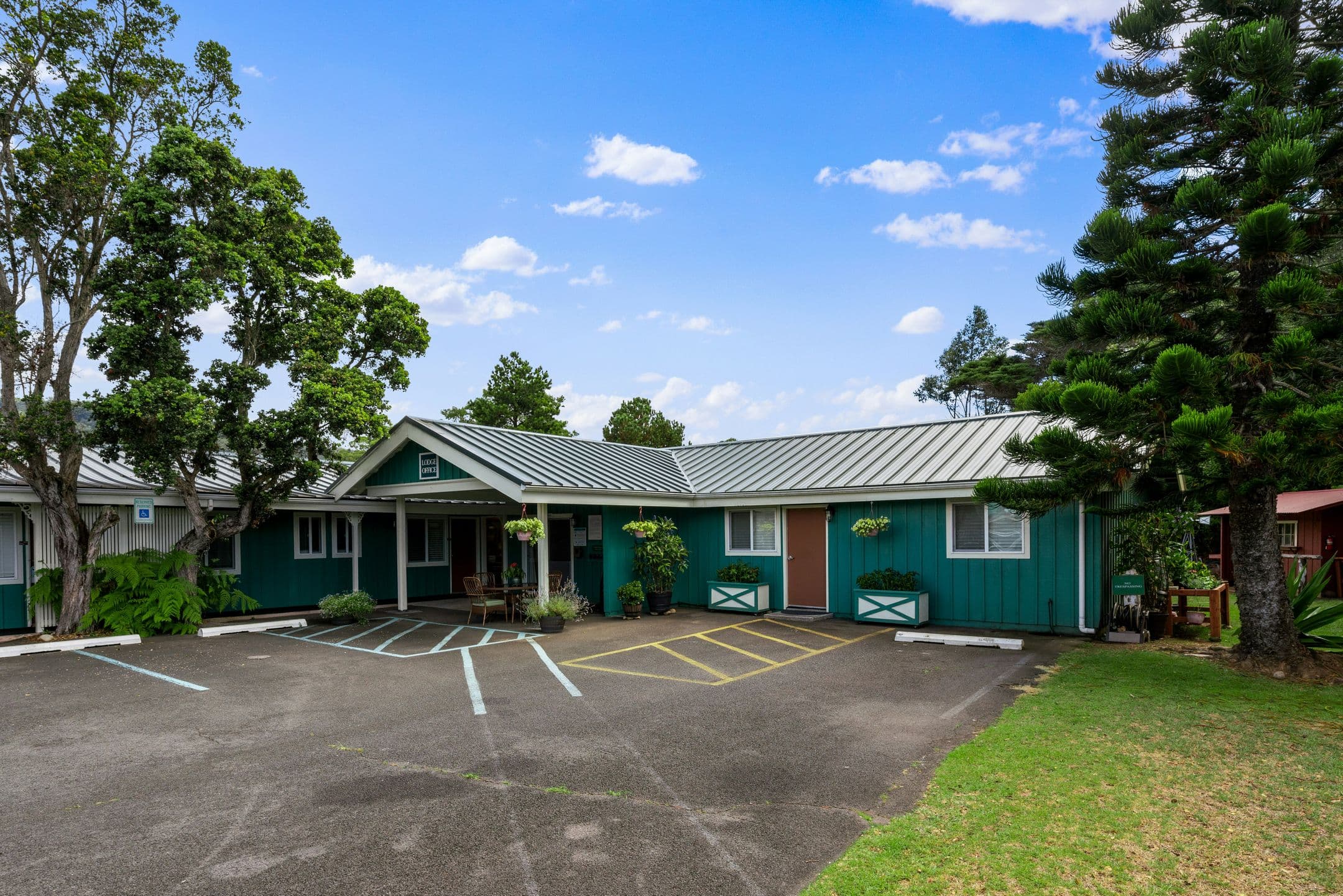 Castle Waimea Country Lodge exterior in upcountry Waimea with rolling green pastures
