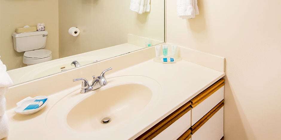 The Bathroom at the 2 bedroom Deluxe Ocean View at Castle Waikiki Shore