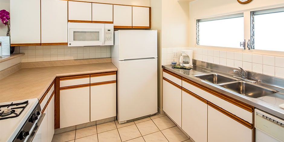 Kitchen at the 2 bedroom Deluxe Park View at Castle Waikiki Shore