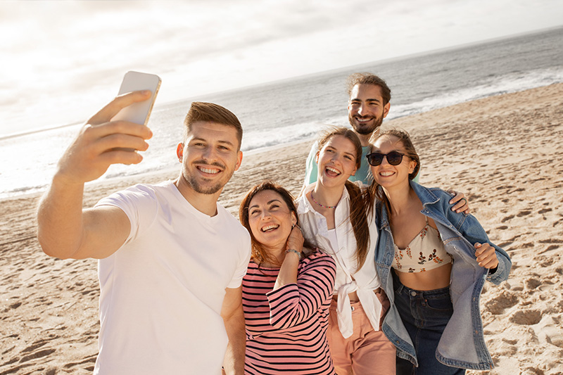 A group of friends gathering on a beach