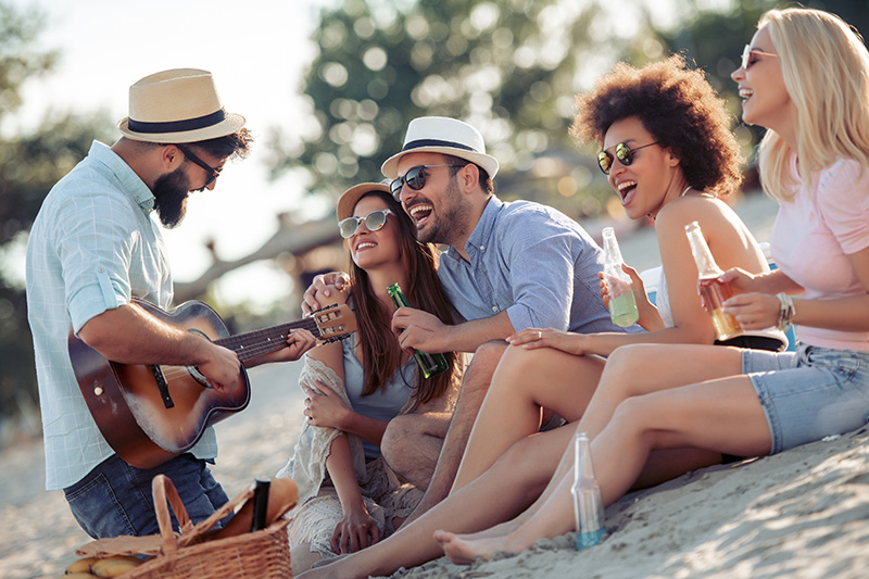 A group of friends, some wearing fedoras